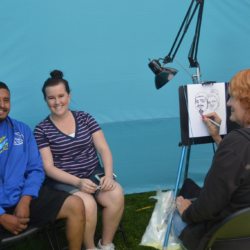 Couple having caricatures sketched