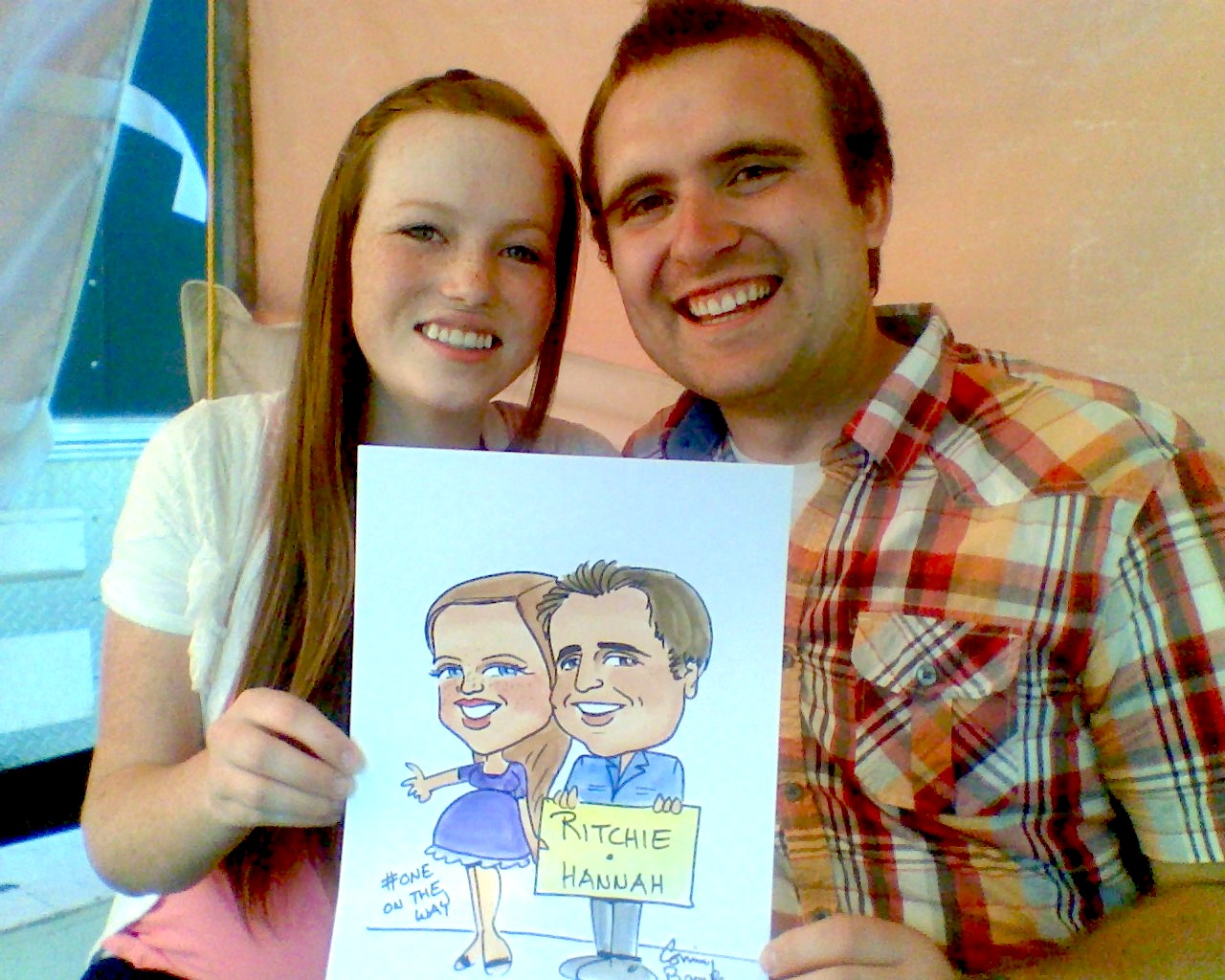 Couple holding caricature sketch